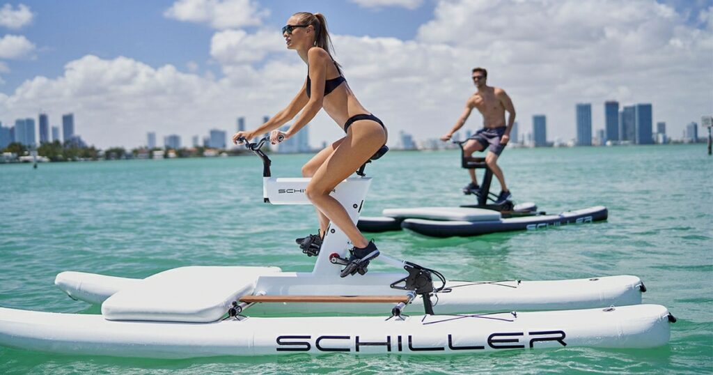 A charter guest from a luxury superyacht using a Schiller Bike on the ocean