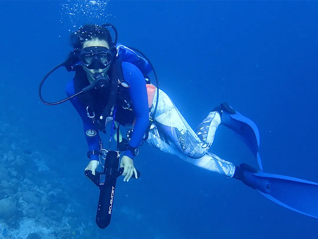 Charter yacht guest diving with a SCUBAJET