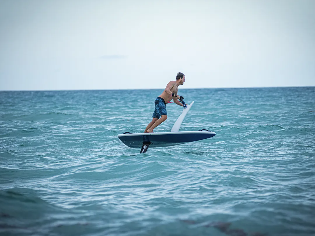 A charter guest from a superyacht riding a Hydroflyer on the sea