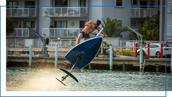 A superyacht crew member doing advanced moves on a Hydroflyer