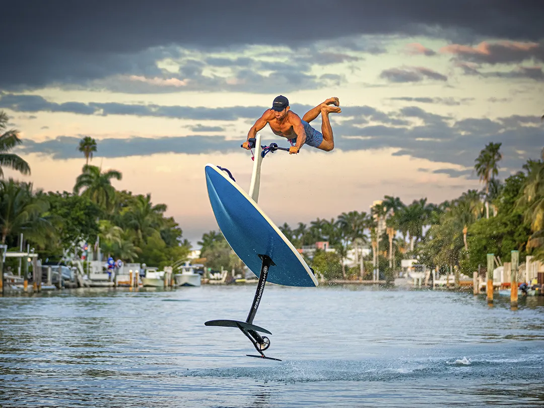 A superyacht crew member doing stunts on a Hydrofler personal watercraft