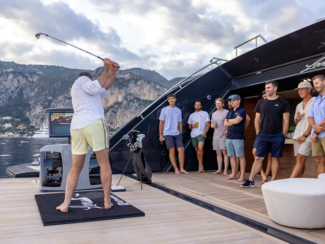 On board golf competition between superyacht crew and charter guests