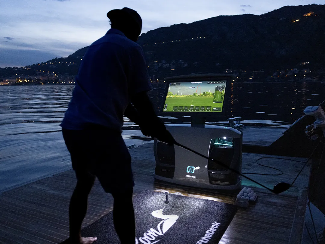 charter guest playing golf in the evening with an Off the Deck SeaDriveCX