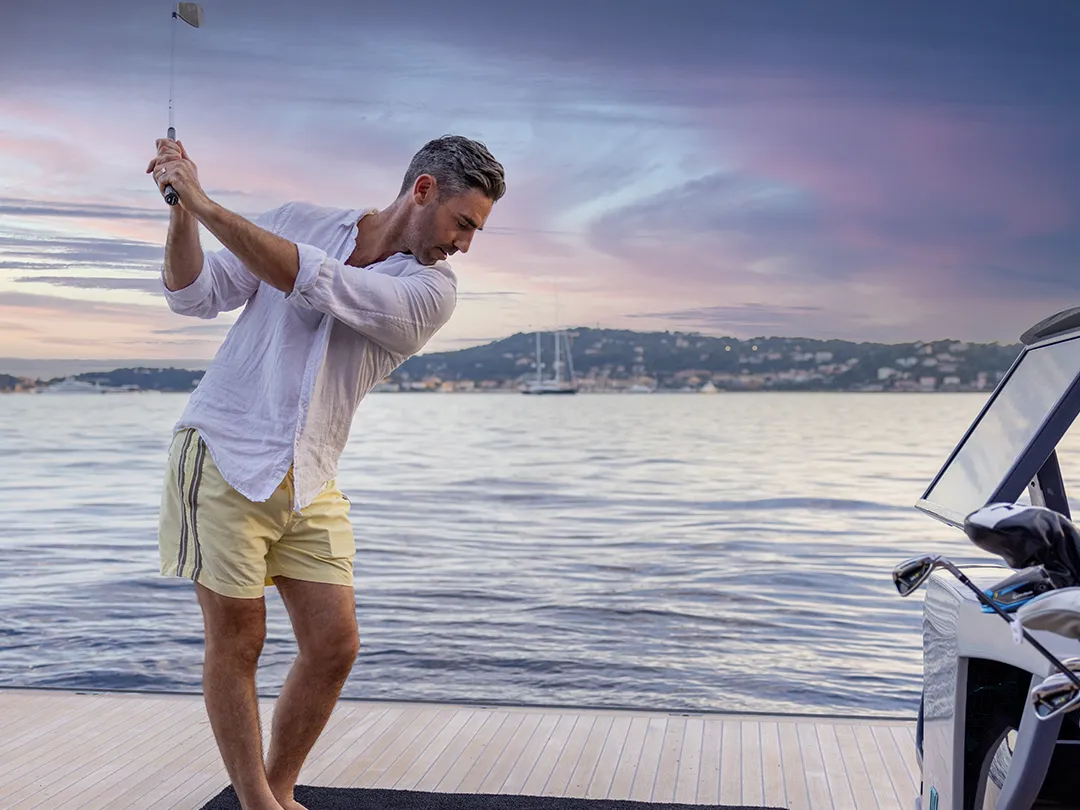 charter superyacht guest playing yacht golf with off the Deck