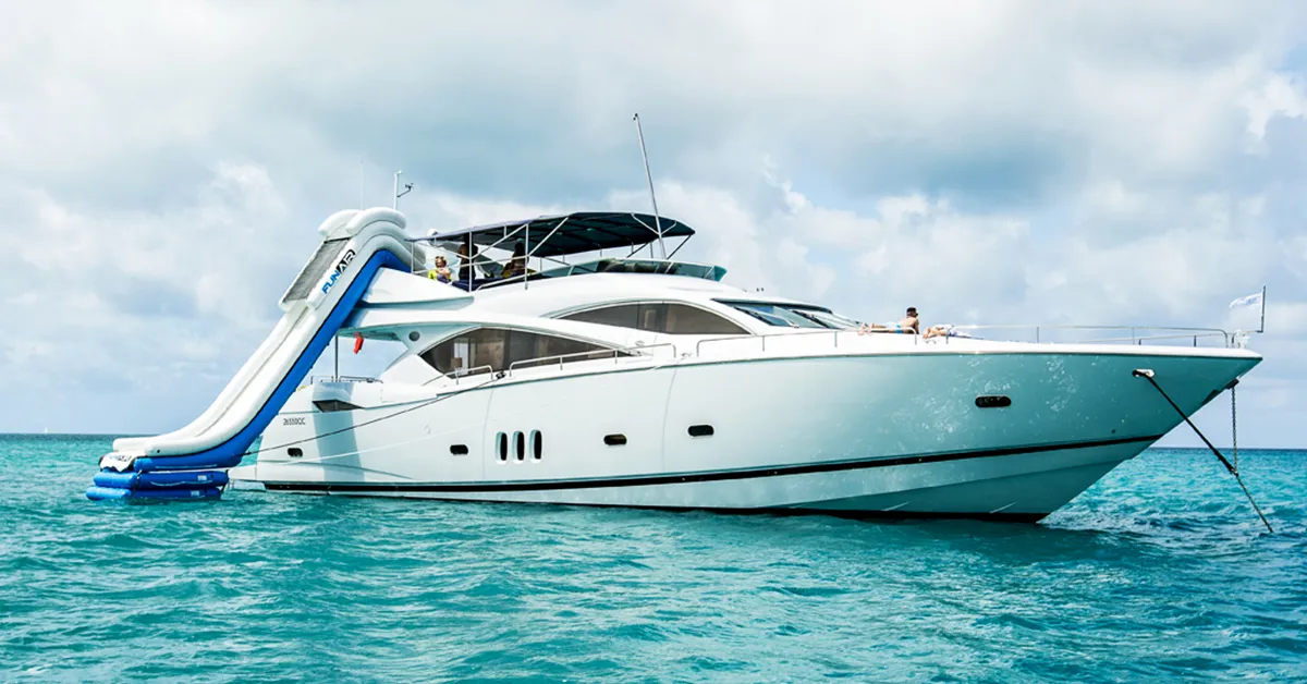 A luxury charter yacht with FunAir yacht slide during a 2025 yacht vacation