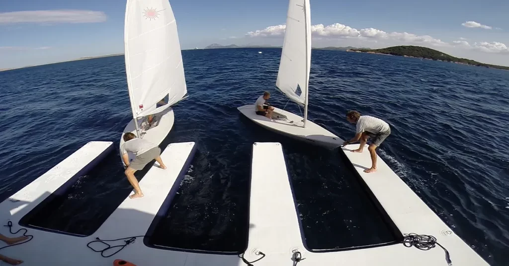 Small sailboats docking on a FunAir inflatable dock
