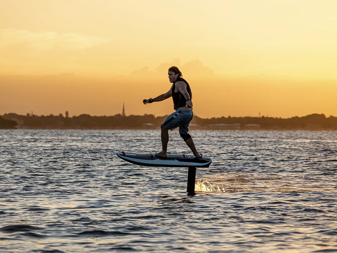 yacht guest riding a MoreFun Awake superyacht toy during a luxury charter