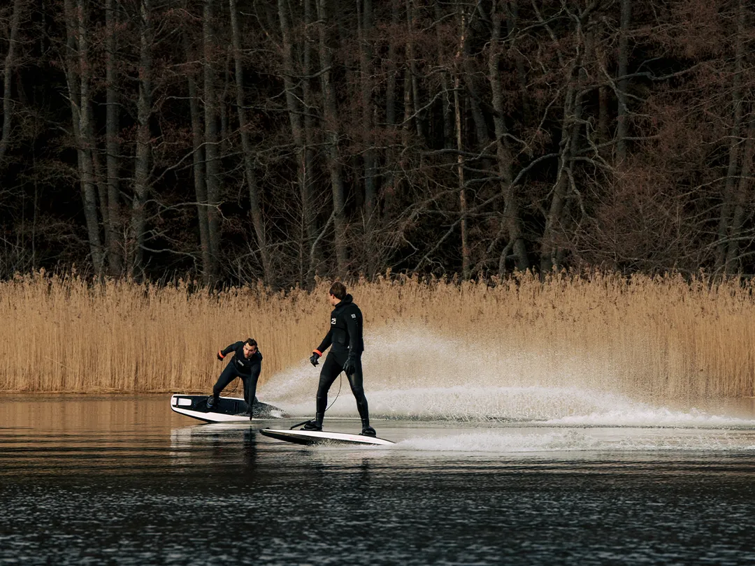 yacht guests riding Awake Boards in the Winter
