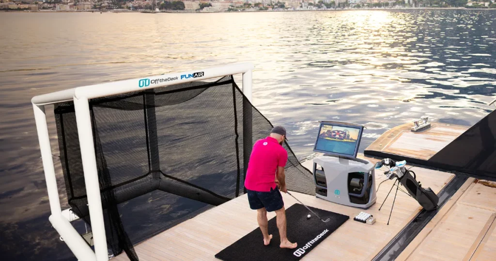Superyacht charter guest playing golf with Off the Deck SeaDrive