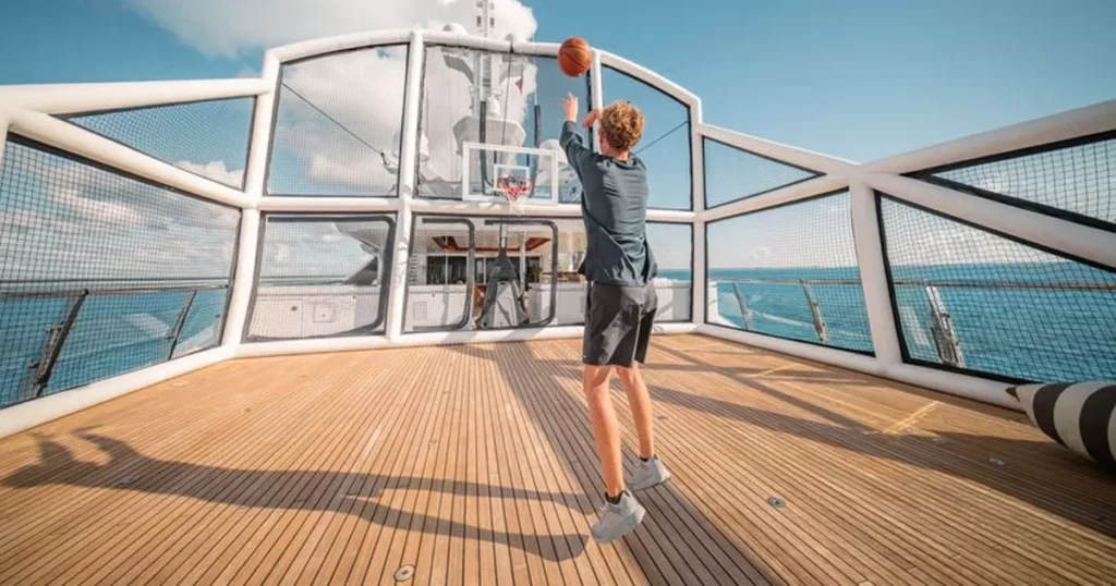 superyacht charter guests playing basketball in the FunAir inflatable Sports Court on Motor Yacht Batello